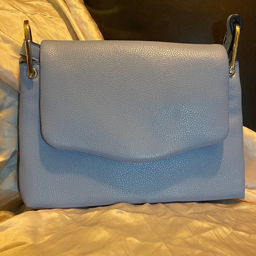 a new day crossbody clutch front flap
Periwinkle blue
Like new